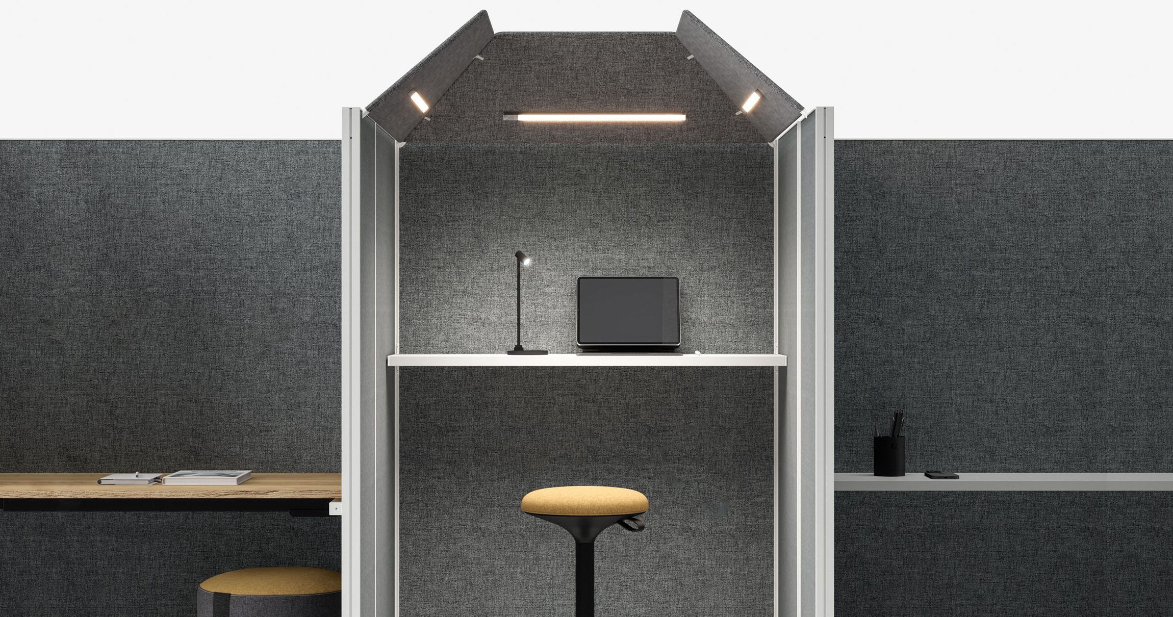Poste de travail isolé par des cloisonnettes acoustiques en feutrine anthracite, mobilier Bralco